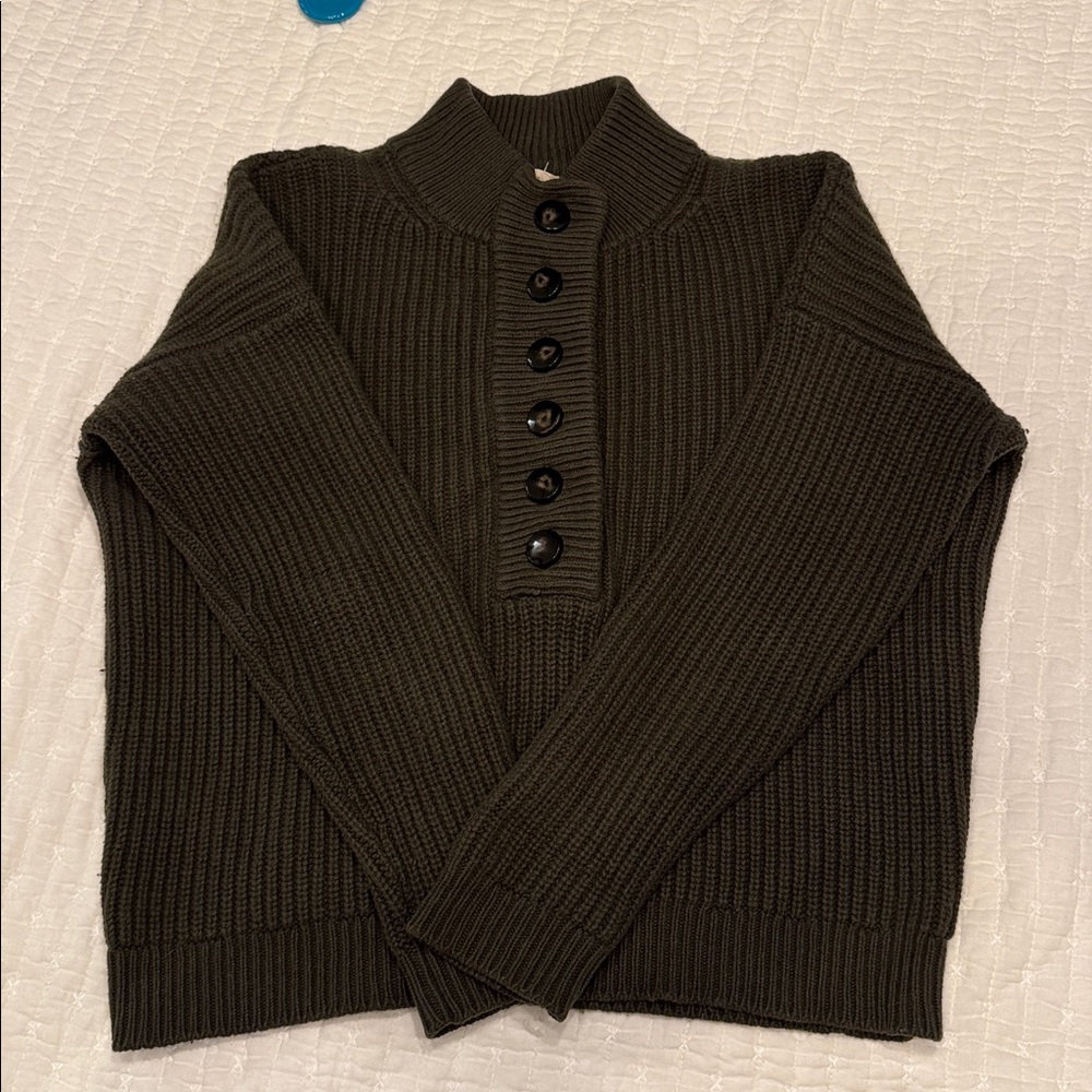 Sezane Lucas olive green sweater with black buttons. Slightly high neckline.